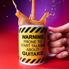 a hand holding a coffee mug with orange liquid pouring out of it and warning about guitars