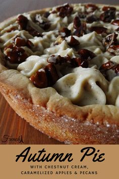 an autumn pie with chestnuts, creme and pecans on a wooden table