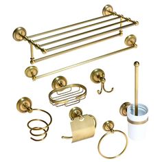 an assortment of brass bathroom accessories including toilet paper