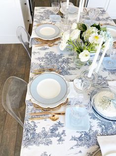 the table is set with blue and white china