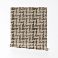 a brown and white checkered cloth on a white background