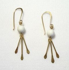 Cute and Lightweight, these earrings are simple and attractive. They are Gold Filled. The Howlite stones are 6 mm rounds. Their overall length including earwires is a little over 1 1/2". Handmade by us.   Lyn's Jewelry, in business operating out of Sunny Syracuse since 1989. Howlite Stone, White Howlite, Gold Filled, Drop Earrings, Stone, Gold, White