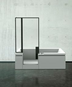 a white sink sitting in front of a mirror