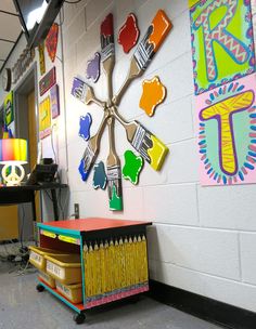 a room filled with lots of different colored items on the wall and decorations hanging from the ceiling