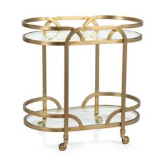 a gold metal and glass serving cart