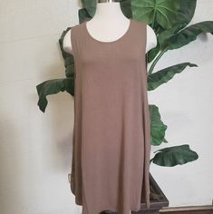 Plus Round Neck Sleeveless Straight Hem Tunic With Side Pockets Total Body Length: 35", Chest: 42" 1x, 44" 2x, 46" 3x Approx. Fabric 55% Polyester 40% Rayon 5% Spandex Casual Sleeveless Khaki Dress, Casual Khaki Sleeveless Dress, Summer Sleeveless Taupe Dress, Taupe Sleeveless Summer Dress, Sleeveless Taupe Summer Dress, Total Body, Mocha, Sleeveless Dress, Round Neck