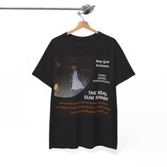 the real slim shady t - shirt is hanging on a clothesline with an image of him