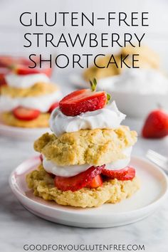 gluten - free strawberry shortcake on a plate with whipped cream and strawberries