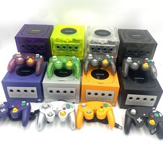 a group of nintendo wii game controllers sitting next to each other on a white surface