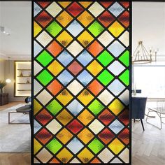 a colorful stained glass window in a living room