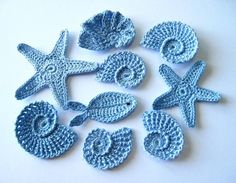 crocheted sea shells and starfishs are featured in the video, get the free pattern at 1204 com