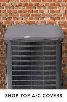 an air conditioner sitting next to a brick wall with the words shop top ac covers