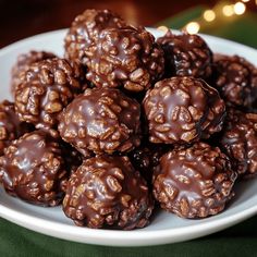 a white plate topped with chocolate covered balls