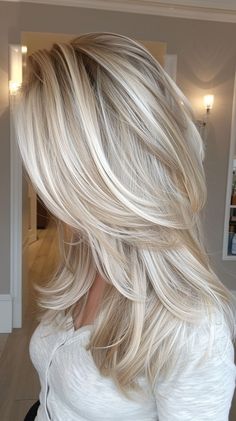 Channel your inner edginess with these 25 medium to long length layered hairstyles that make a statement. Long Heavily Layered Hair, Medium Length Blonde Layers, Medium Long Layers Haircut, Med Length Blonde Hair With Layers, Long Layers Blonde Highlights, Medium Long Blonde Haircut, Platinum Blonde With Layers, Long Layers Around Face, Platinum Layered Hair