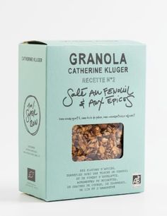 an open box of granola on a white background with the label in front of it