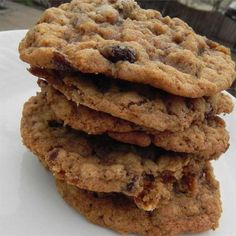 a stack of cookies sitting on top of a white plate