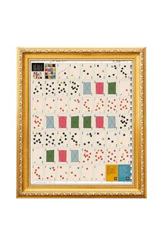 a painting with many different colors and shapes on the canvas, hanging in a gold frame