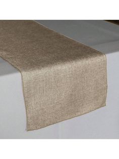 the table runner is made from linen and has a brown border on it, along with a white base