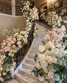 a bunch of flowers that are on some stairs