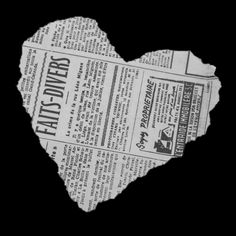 an old newspaper with a heart shaped cutout in the middle, on a black background