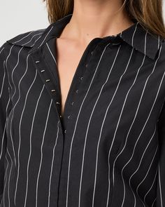 Made from supremely soft 100% cotton, this classic black and off-white striped long sleeve shirt is designed with a hook-and-eye closure and a flattering, fitted silhouette with a front notch. | Rosaly Shirt - Black/Buttercream | Size 14 Classic Long Sleeve Pinstripe Tops, Elegant Black Top With Vertical Stripes, Classic Long Sleeve Tops With Vertical Stripes, Chic Pinstripe Cotton Shirt, Pinstripe Long-sleeved Shirt With Button Closure, Spring Pinstripe Long Sleeve Shirt, Fall Pinstripe Long Sleeve Tops, Black Long Sleeve Blouse With Vertical Stripes, Black Shirt With Vertical Stripes For Spring