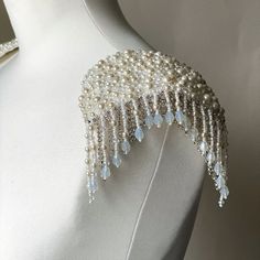 These gorgeous pearl epaulettes are unique and one of a kind piece of shoulder jewelry to go with your wedding dress, party dress or to add a touch of elegance to any formal outfit, letting you sparkle on your special event. Handmade of real pearls and sparkling rhinestones, these shoulder epaulettes will adore your outfit and make you feel like a red carpet celebrity. If you are looking a perfect finishing to your wedding dress, these epaulettes will make your bridal look gorgeous. No matter whether you are wearing your wedding dress, jacket or just casual shirt ― these epaulettes make you feel so special and enjoy yourself! • The epaulettes securely fasten with special pins. Size Width – 5.1 inLength – 3.5 inFringe – 5 in Weight – 80 gr each one Be sure, when placing an order in my shop, Wedding Dress Jacket, Headband Veil, Shoulder Jewelry, Shoulder Epaulettes, Shoulder Cape, Sleeved Wedding, Cape Sleeves, Celebrity Red Carpet, Dress Jacket