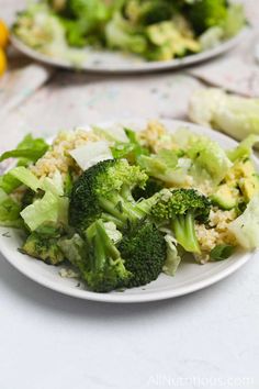 broccoli and cauliflower on a plate with lemons in the background