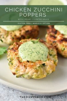 chicken zucchini poppers with creamy cilantro sauce on a white plate