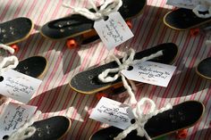 there are many skateboards that have been tied up to each other with tags on them