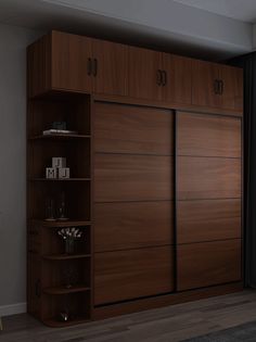 an empty room with a large wooden closet