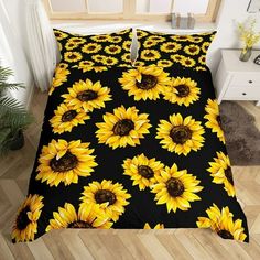 a bed with yellow sunflowers on it