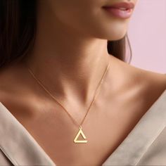 Triangle 925 silver or 18k gold plated charm necklace for gift Our handmade silver necklaces make wonderful and delicate gifts for you.  Materials: -High Quality 925 Sterling Silver -18k Gold Plated Silver -18k Rose Gold Plated Silver Colors: -Gold -Rose Gold -Silver Please choose from options tag, if you would like a different color than the one shown in our pictures Packaging: All necklaces are carefully packaged and sent in a special gift box. We hope you find the perfect personalized necklace in our store. For more examples, please visit our store. Ordering Process: -Choose your preferred color and option. -Select the necklace length: Standard 16" or 12" for kids. -If you have any additional specifications, please message us. -Click "Add to cart" or "Buy it now". Thank you! Shipping: S Silver Gold Necklace, Triangle Necklace, Silver 925 Necklace, Christmas Gifts For Her, Personalized Necklace, Gold Plated Silver, Minneapolis, Handmade Silver, Silver Necklaces