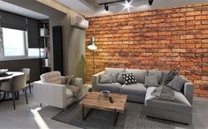 a living room filled with furniture next to a brick wall