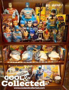 batman action figures are on display in a toy store shelf with the words cool and collected below them