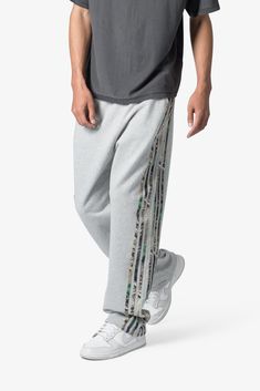 the Hunter Camo Stripe Sweatpants are designed with a relaxed fit throughout, featuring an elasticized self waist, tonal cotton drawstrings, standard hem at the leg opening, hunter camo patterned stripes at the outseam, and finished with a vintage wash. details relaxed fit 100% cotton model is 6’1, 140 lbs and wears a size medium Sporty Camouflage Cotton Bottoms, Casual Camouflage Cotton Sweatpants, Camouflage Cotton Sweatpants For Streetwear, Camouflage Cotton Bottoms With Elastic Waistband, Striped Sweatpants, 140 Lbs, The Hunter, Denim Patchwork, Short Tops