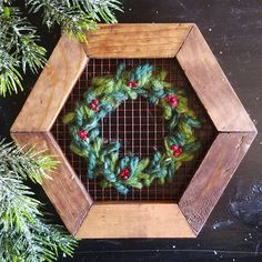 a wooden frame with a wreath on it