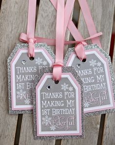 three tags that say thank for the first birthday girl with pink ribbons and glitter on them