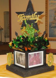 a table with a star on top and flowers in the center