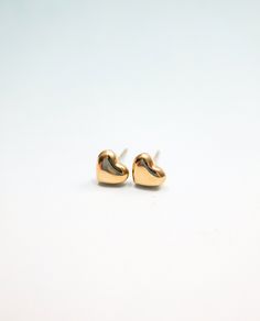 This mini heart stud, featuring 316L Surgical steel with gold plating, look incredible cute and dainty. It makes great gift for yourself and your loved ones.  Size: Height 5mm, Width 7mm  Butterfly Back  Earring post thickness: 21ga (0.7mm)  Sold as a pair Earrings For Sensitive Ears, Tiny Heart, Mini Heart, Hypoallergenic Earrings, Heart Studs, Sensitive Ears, Gold Heart, Jewelry Earrings Studs, Handmade Earrings