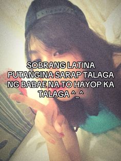 a woman laying in bed holding a cell phone with the caption saying,'soriang latina putangna sarap talaga no bera na to hayopka