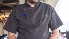 a man wearing a chef's hat and apron