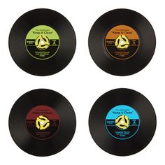 four records with different colored labels on them