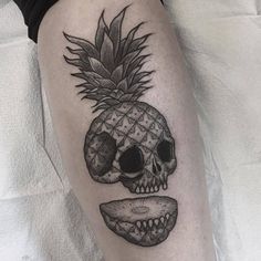 a skull with a pineapple on it's head is shown in black and white