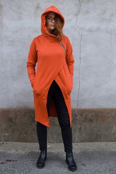 "Express Shipping to the USA, UPS Courier for free Delivery 3-5 Business Days Burnt Orange Coat, Hooded Coat, Women Hoodie Thanks for your love for the Hoodie/Coat. Our Hoodie is made from very good grade cotton from Poland, intense Orange color. On the front you can find orginal asymmetrical zip closure and two side/front pockets. This Hoodie has the special hood and extra long sleeves with thumb holes. It is suitable for all seasons. You will love the loose and comfortable design. Sweatshirt m Orange Long Sleeve Hoodie For Winter, Orange Hooded Sweatshirt For Fall, Orange Drawstring Hood Outerwear For Fall, Orange Outerwear With Drawstring Hood For Fall, Fall Outerwear With Double-lined Hood And Funnel Neck, Hooded Orange Outerwear For Fall, Casual Orange Hoodie Outerwear, Fall Outerwear With Funnel Neck And Adjustable Hood, Fall Outerwear With Adjustable Hood And Funnel Neck