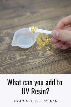 a person holding a spoon with yellow glitter on it and the words, what can you add to u - resin? from glitter to inks