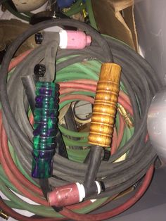 several different types of hoses sitting on top of each other