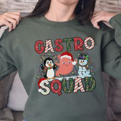 Gastro Christmas Crewneck, Long Sleeve Tee or T-Shirt makes the perfect holiday season shirt for endoscopy nurse, GI Tech, or gastroenterology doctor! T-shirt: This is made with the Bella & Canvas 3001 classic unisex jersey short sleeve tee.  It fits like a well-loved favorite, soft cotton and quality print make users fall in love with it over and over again. These t-shirts have-ribbed knit collars to bolster shaping. The shoulders have taping for better fit over time. Dual side seams hold the g Holiday Apparel, Work Party, Crew Shirt, Nursing Shirts, Perfect Shirt, Christmas Sweatshirts, Holiday Outfits, Long Sleeve Tee, Jersey Shorts