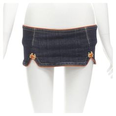 DSQUARED2 2005 Runway orange crab button denim micro mini skirt IT40 S Reference: ANWU/A01012 Brand: Dsquared2 Collection: 2005 - Runway Material: Denim Color: Blue, Orange Closure: Zip Extra Details: Indigo denim with orange piping. Gold-tone enamel Crab charm. Dual patch back pocket. Zip back closure. Thong lining. Made in: Italy CONDITION: Condition: Unworn in mint condition, with tags. Comes with: Designer tags. SIZING Designer size: IT40 Size reference: US2-4 / UK8 / IT40 / FR36 / XS-S MEAS Insane Fashion, Denim Micro Mini Skirt, Pride 2024, Meadham Kirchhoff, Christian Dior Designer, Issey Miyake Pleats Please, Summer Pieces, Pucci Print, Denim Projects