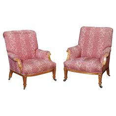 two pink chairs sitting next to each other