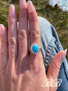 Big and beautiful sleeping beauty turquoise cabochon and 6A quality cubic zirconia sterling silver statement halo ring. This beautiful sleeping beauty cabochon is made from 100% natural sleeping beauty gemstone powder that has been hardened into a cab stone with clear resin.  Because these cabochons are a mixture of the natural powdered stone, they will have a uniform look and you don't have to worry about imperfections or inclusions in the turquoise stone.  The cab you get will look like the ph Luxury Turquoise Jewelry With Center Stone, Luxury Oval Turquoise Gemstone Ring, Turquoise Jewelry With Halo Setting For Gift, Turquoise Jewelry With Halo Setting As A Gift, Elegant Turquoise Ring With Center Stone, Elegant Turquoise Jewelry With Center Stone, Turquoise Jewelry With Center Stone, Gift Diamond Turquoise Cabochon Ring, Luxury Oval Turquoise Ring Gift